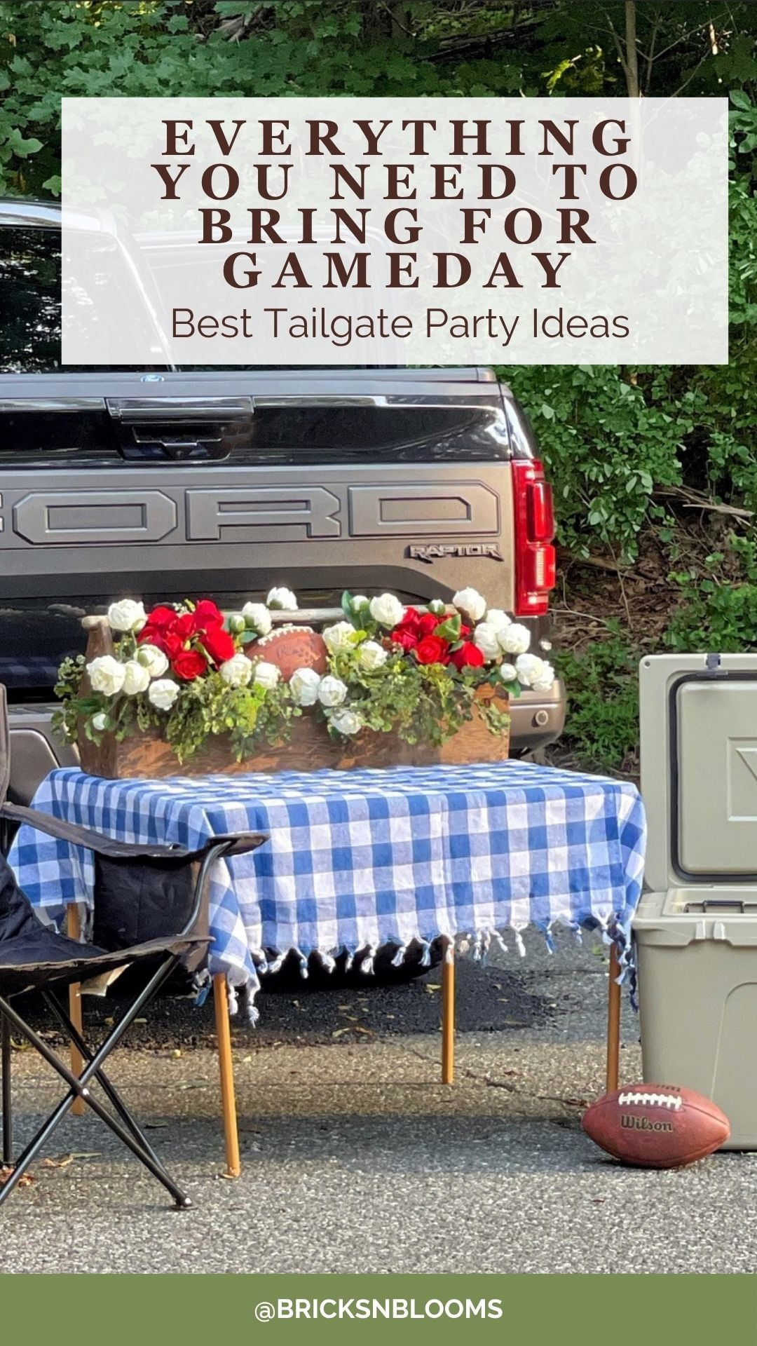A truck tailgate scene with a table covered by a blue plaid cloth, floral arrangements, footballs, a cooler, and a football on the ground. Text reads, “Everything You Need to Bring for Gameday.” Discover fun tailgate party ideas to make your celebration unforgettable.