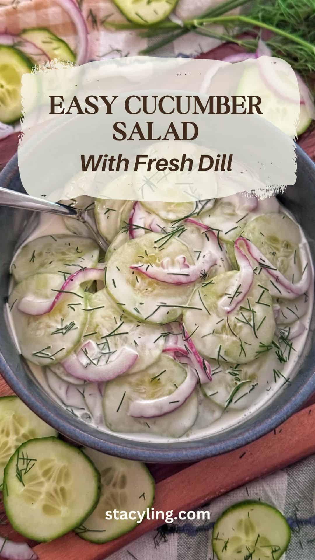 A bowl of cucumber salad with dill, featuring sliced cucumbers, red onions, and fresh dill in a creamy dressing. The image text reads: "Easy Cucumber Salad with Fresh Dill." Slices of cucumber are nearby.