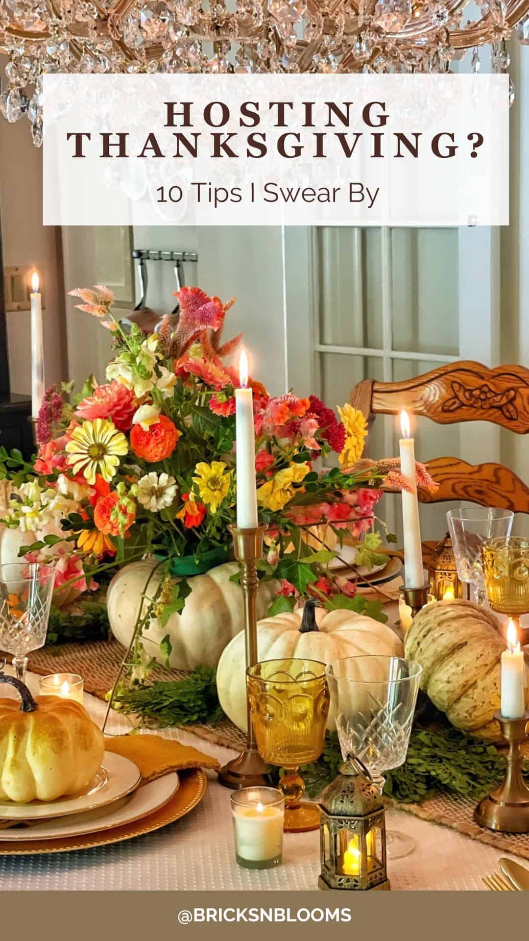 A festive Thanksgiving 2025 table is set with pumpkins, candles, flowers, and elegant dishes. A chandelier hangs above, and a sign reads, “Hosting Thanksgiving? 10 Tips I Swear By.” @BRICKSNBLOOMS is noted at the bottom.