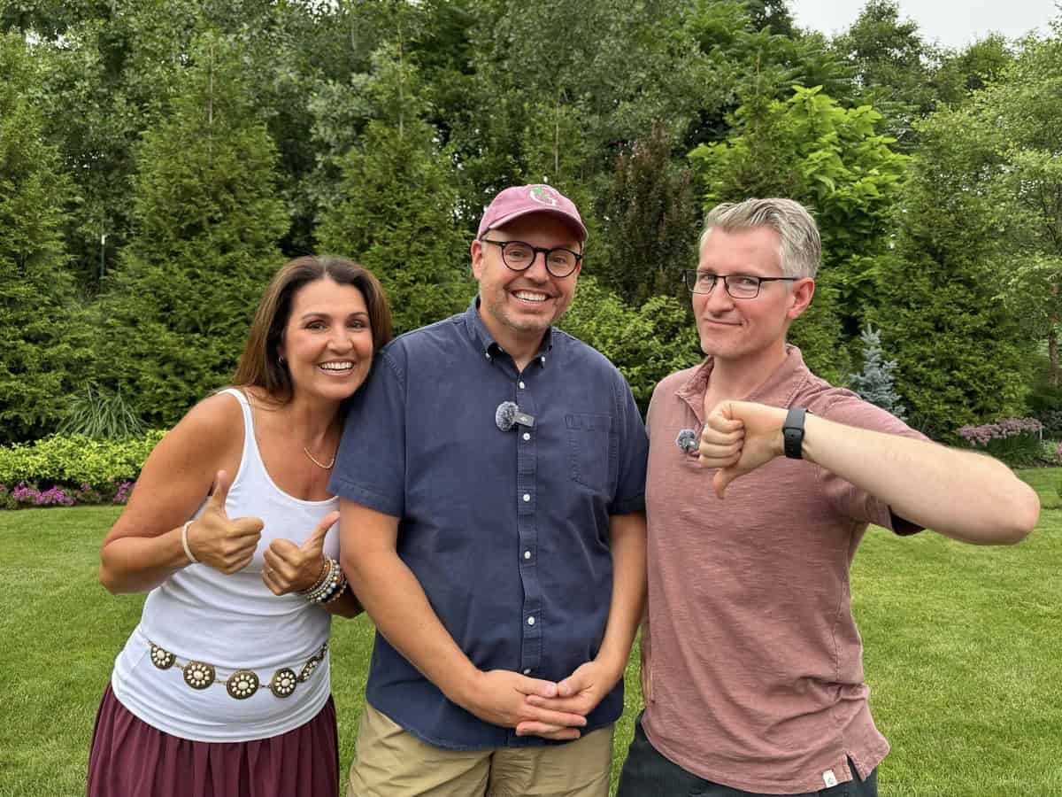 stacy ling, eric and christopher from frow for me gardening stand outside on grass with trees behind them. The woman on the left and the man in the center are smiling with thumbs up, while the man on the right gives a thumbs down. All are casually dressed.